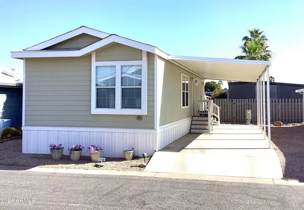 a front view of a house with yard