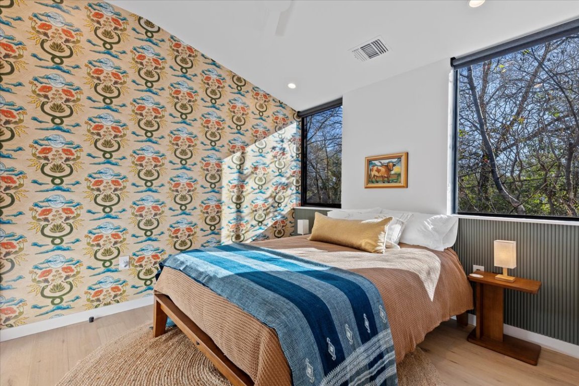 1709 Willow Street, Unit 2 Austin, TX 78702 - Photo 12 of 20 a bedroom with a bed and a painting on the wall