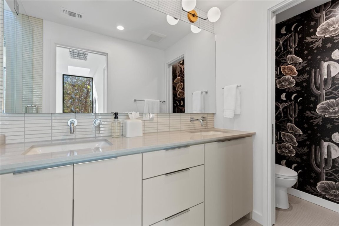1709 Willow Street, Unit 2 Austin, TX 78702 - Photo 13 of 20 a bathroom with a sink and a mirror