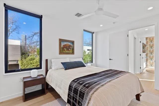 a bedroom with a bed and a window