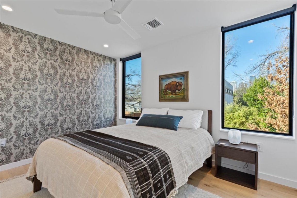 1709 Willow Street, Unit 2 Austin, TX 78702 - Photo 16 of 20 a bedroom with a bed and a painting on the wall