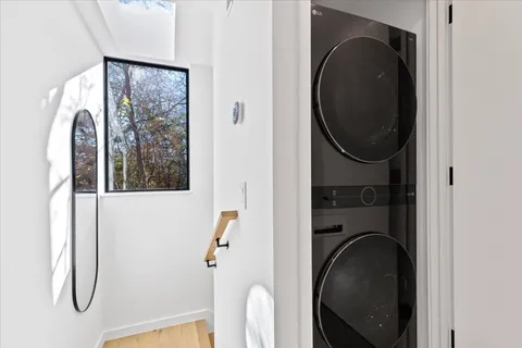 a close view of a utility room with dryer and washer