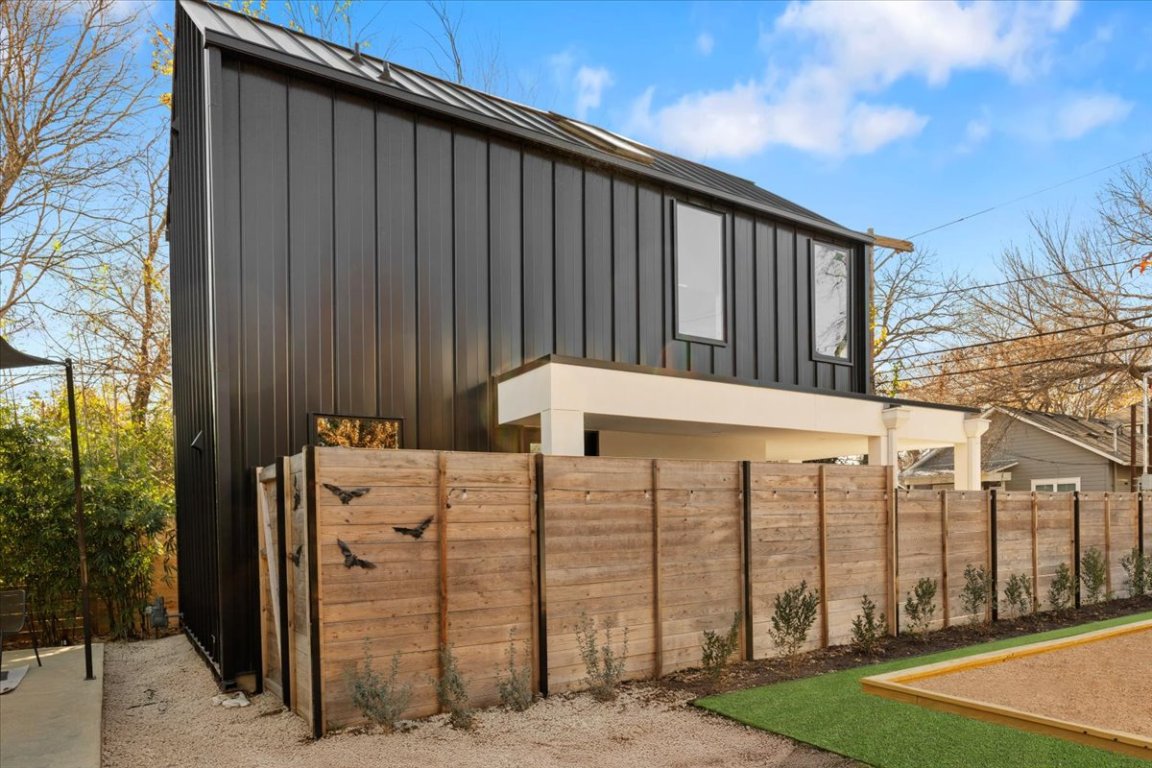 1709 Willow Street, Unit 2 Austin, TX 78702 - Photo 20 of 20 a view of a wooden house with a large tree