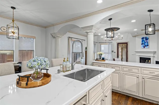 a kitchen with a sink stove and microwave