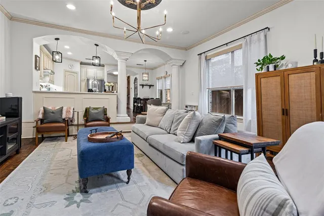 a living room with furniture kitchen view and a fireplace