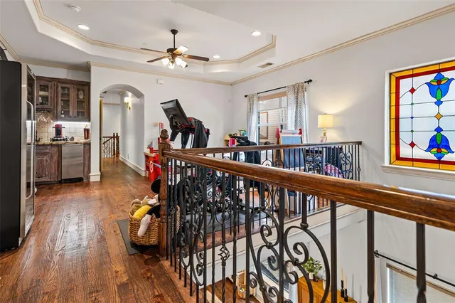 a living room with furniture and paintings on the wall