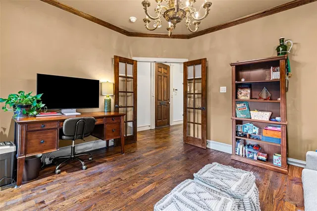 a view of a livingroom with furniture and workspace