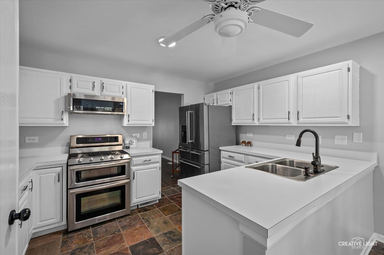 13494 Redberry Circle Plainfield, IL 60544 - Photo 7 of 27 a kitchen with sink a stove and refrigerator