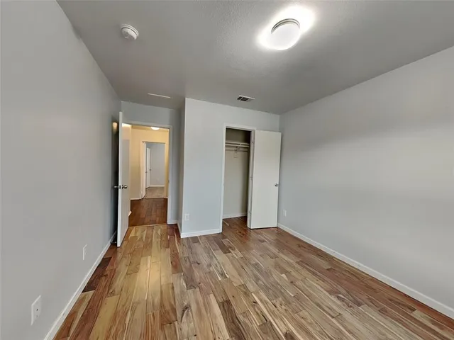 wooden floor in a hall with a window