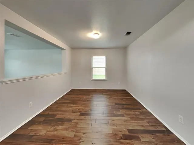 a view of an empty room and window