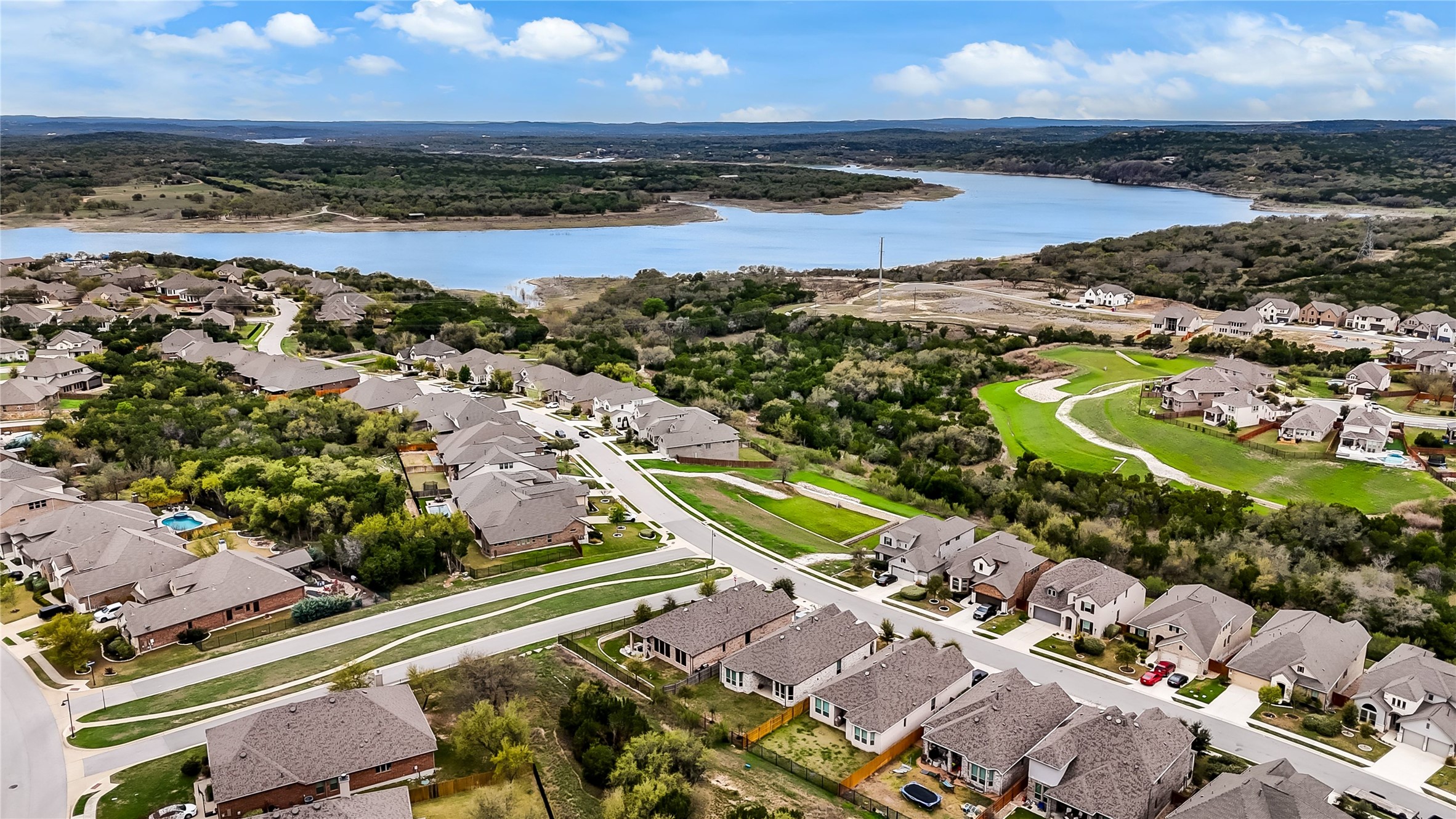 7705 Pace Ravine Drive Lago Vista, TX 78645 - Photo 30 of 40 Aerial perspective of suburban area featuring a nearby body of water