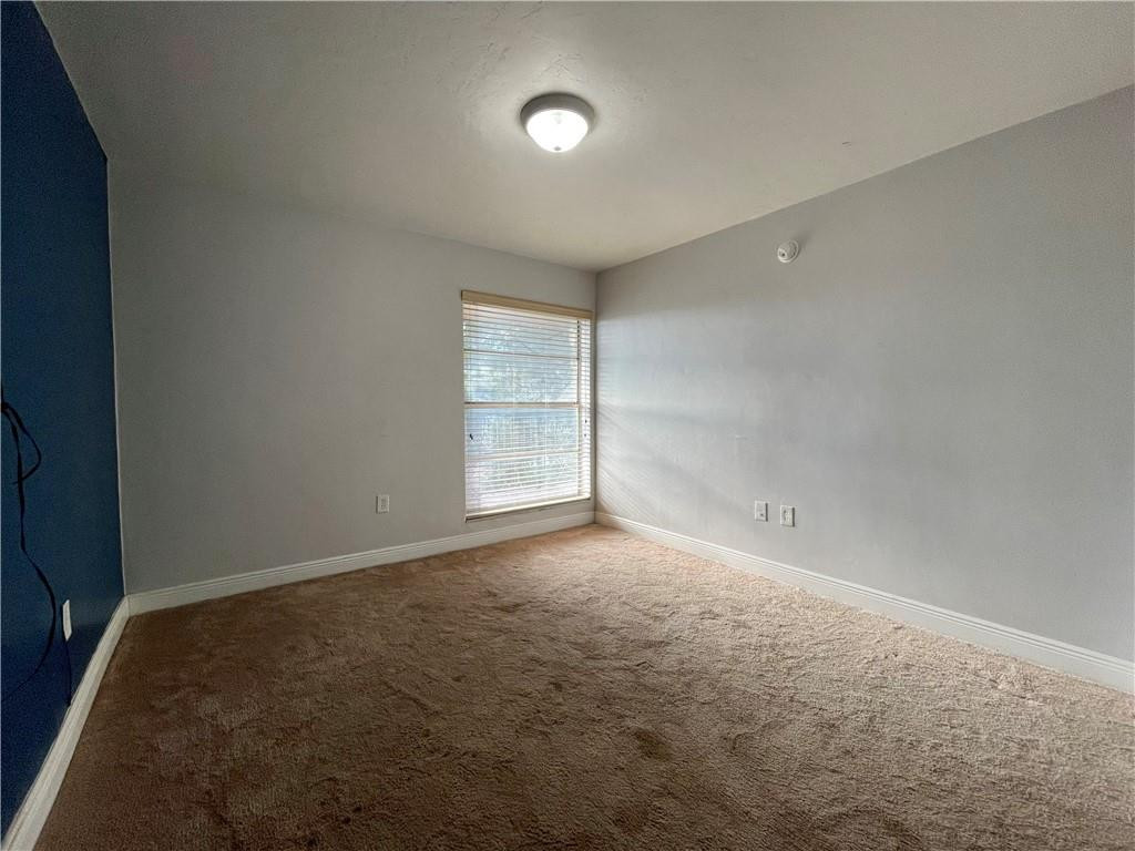 1990 West 56th Street, Unit 1205 Hialeah, FL 33012 - Photo 11 of 16 an empty room with windows and entrance