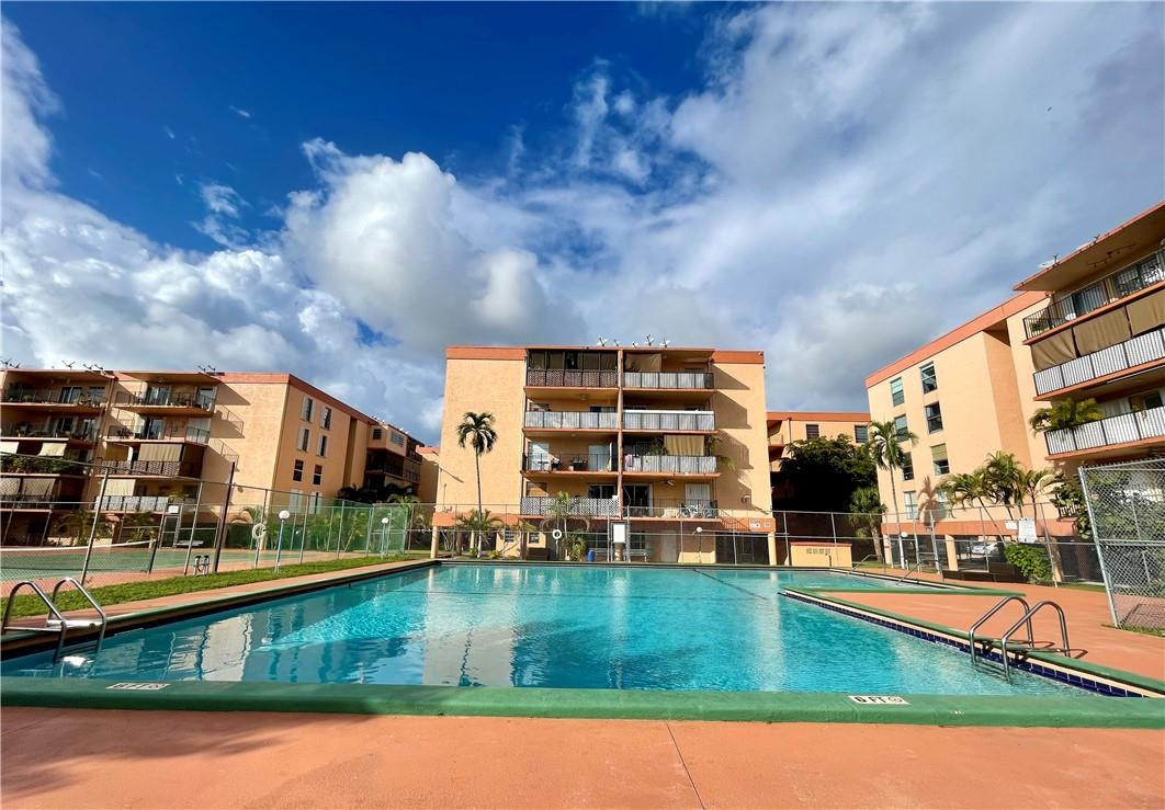 1990 West 56th Street, Unit 1205 Hialeah, FL 33012 - Photo 14 of 16 a view of pool with outdoor seating
