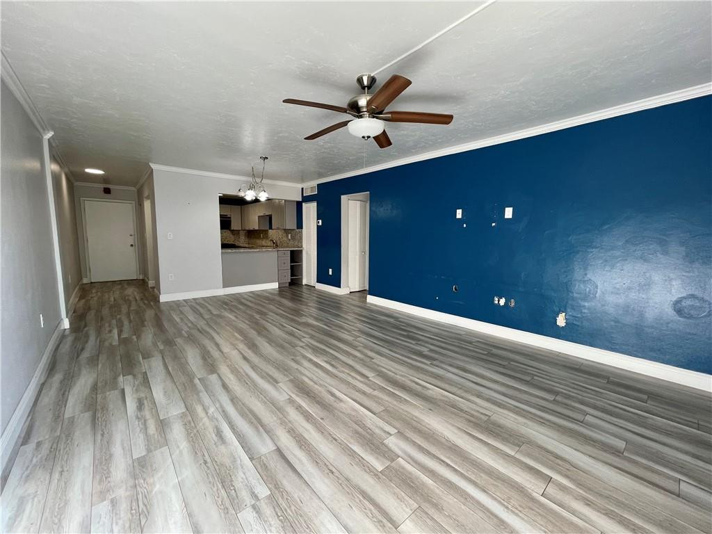 1990 West 56th Street, Unit 1205 Hialeah, FL 33012 - Photo 4 of 16 a view of a livingroom with a ceiling fan