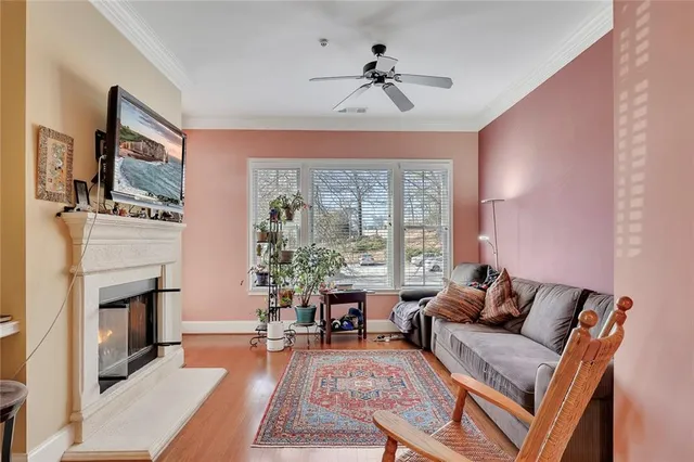 a living room with furniture fireplace and flat screen tv