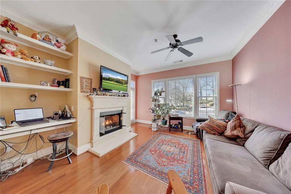 11 Perimeter Centre East, Unit 1112 Atlanta, GA 30346 - Photo 13 of 38 a living room with furniture fireplace and flat screen tv