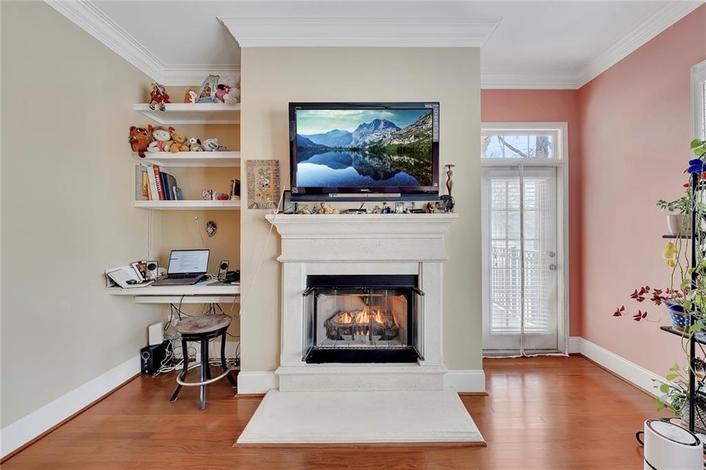 11 Perimeter Centre East, Unit 1112 Atlanta, GA 30346 - Photo 14 of 38 a living room with furniture and a fireplace