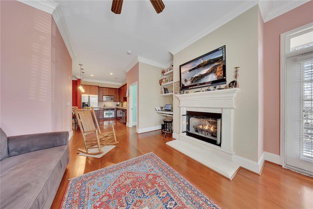 11 Perimeter Centre East, Unit 1112 Atlanta, GA 30346 - Photo 16 of 38 a living room with furniture and a fireplace