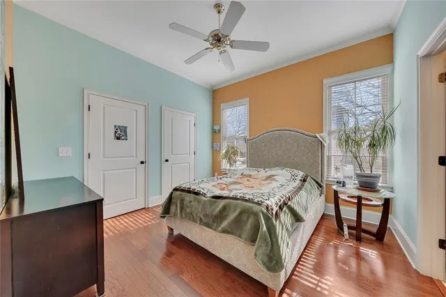 a bedroom with a large bed and a dresser