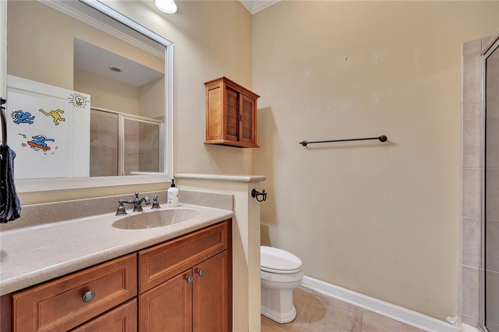 11 Perimeter Centre East, Unit 1112 Atlanta, GA 30346 - Photo 23 of 38 a bathroom with a sink a toilet and shower