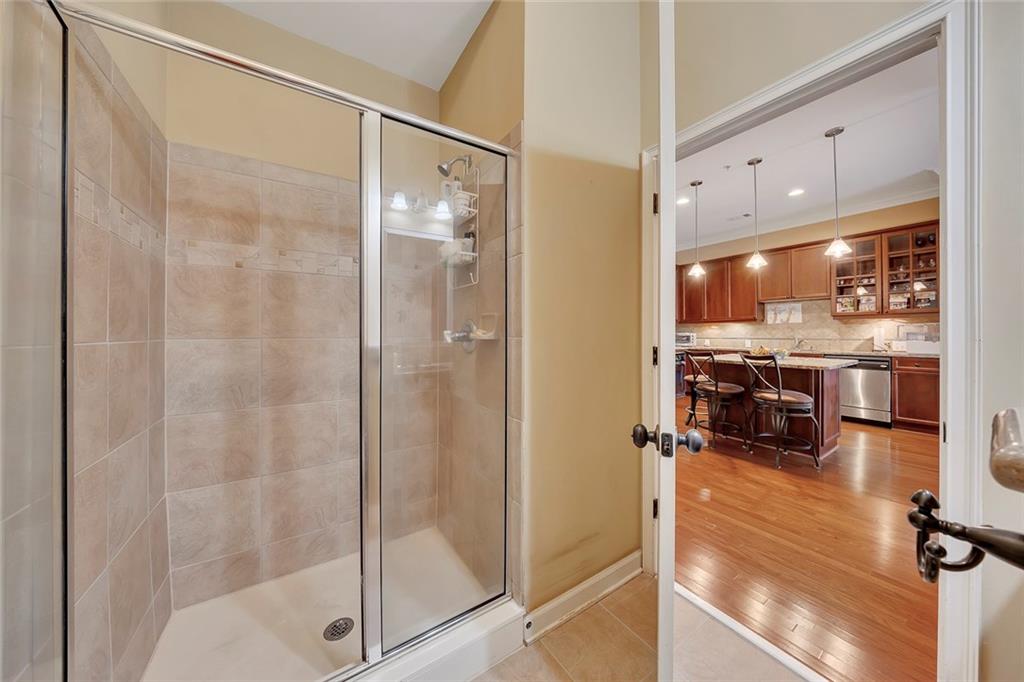 11 Perimeter Centre East, Unit 1112 Atlanta, GA 30346 - Photo 24 of 38 a bathroom with a glass shower door