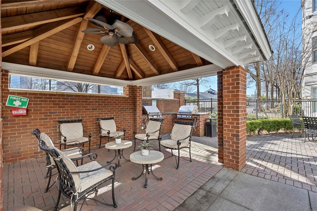 11 Perimeter Centre East, Unit 1112 Atlanta, GA 30346 - Photo 30 of 38 a view of a patio with table and chairs and potted plants