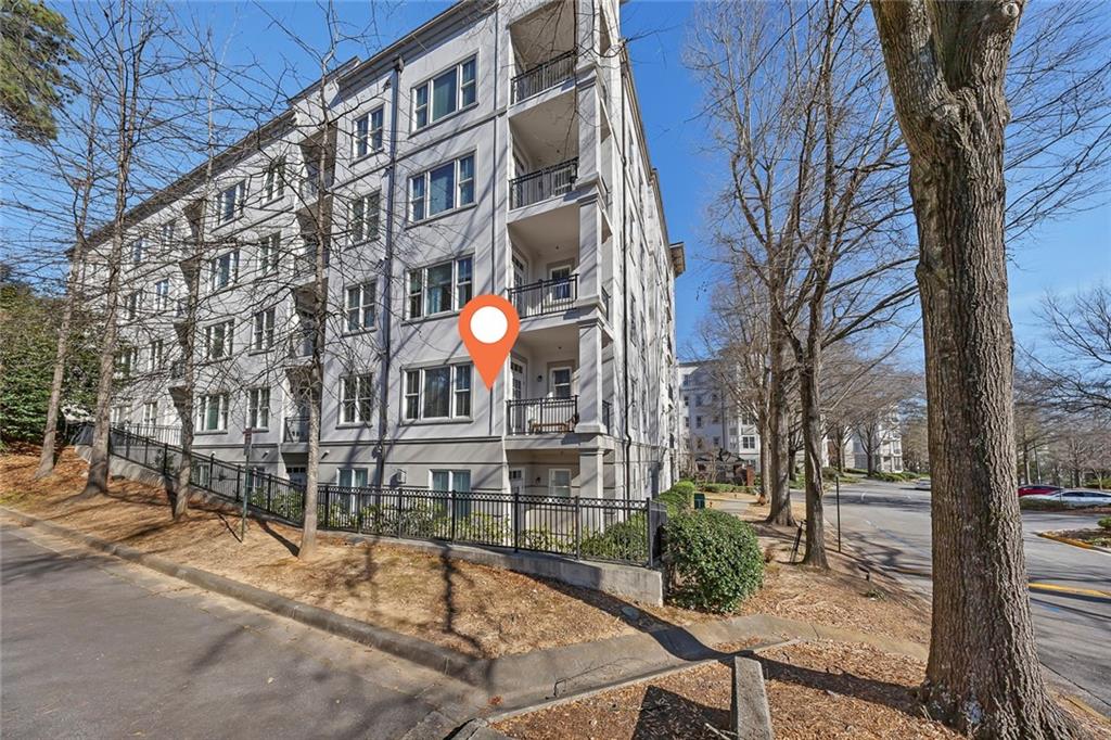 11 Perimeter Centre East, Unit 1112 Atlanta, GA 30346 - Photo 3 of 38 a view of a building with a backyard