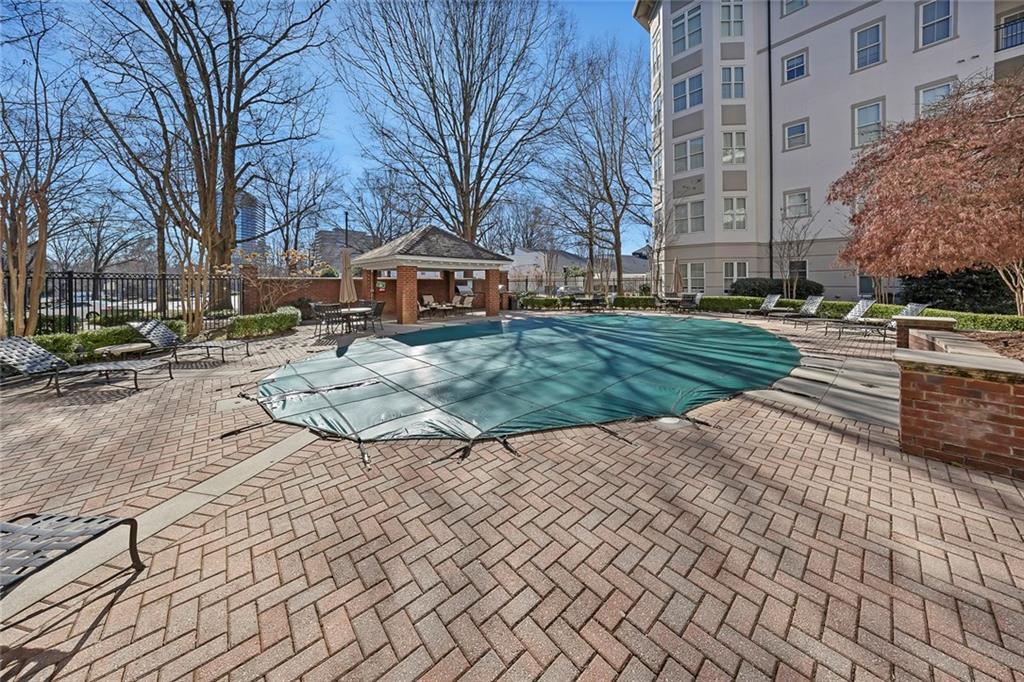 11 Perimeter Centre East, Unit 1112 Atlanta, GA 30346 - Photo 34 of 38 a front view of a building with a yard