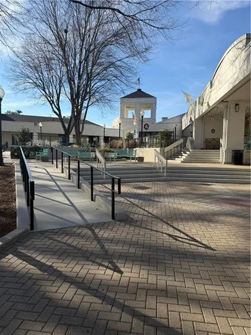 a view of swimming pool with outdoor seating