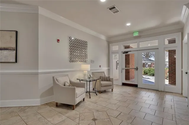 a living room with furniture and large window