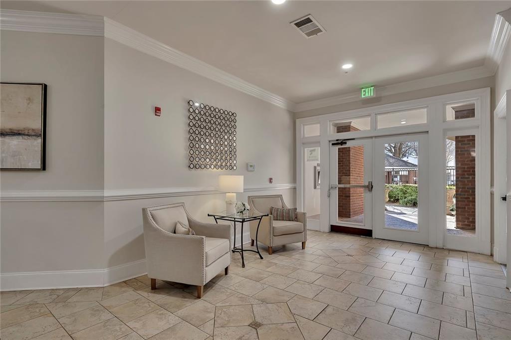 11 Perimeter Centre East, Unit 1112 Atlanta, GA 30346 - Photo 5 of 38 a living room with furniture and large window