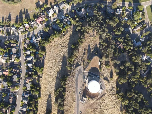 a aerial view of a house with a yard and garden