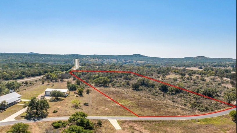 285 Comanche Ridge Round Mountain, TX 78663 - Photo 4 of 4 Overview of rural landscape with property boundaries highlighted and a mountainous background