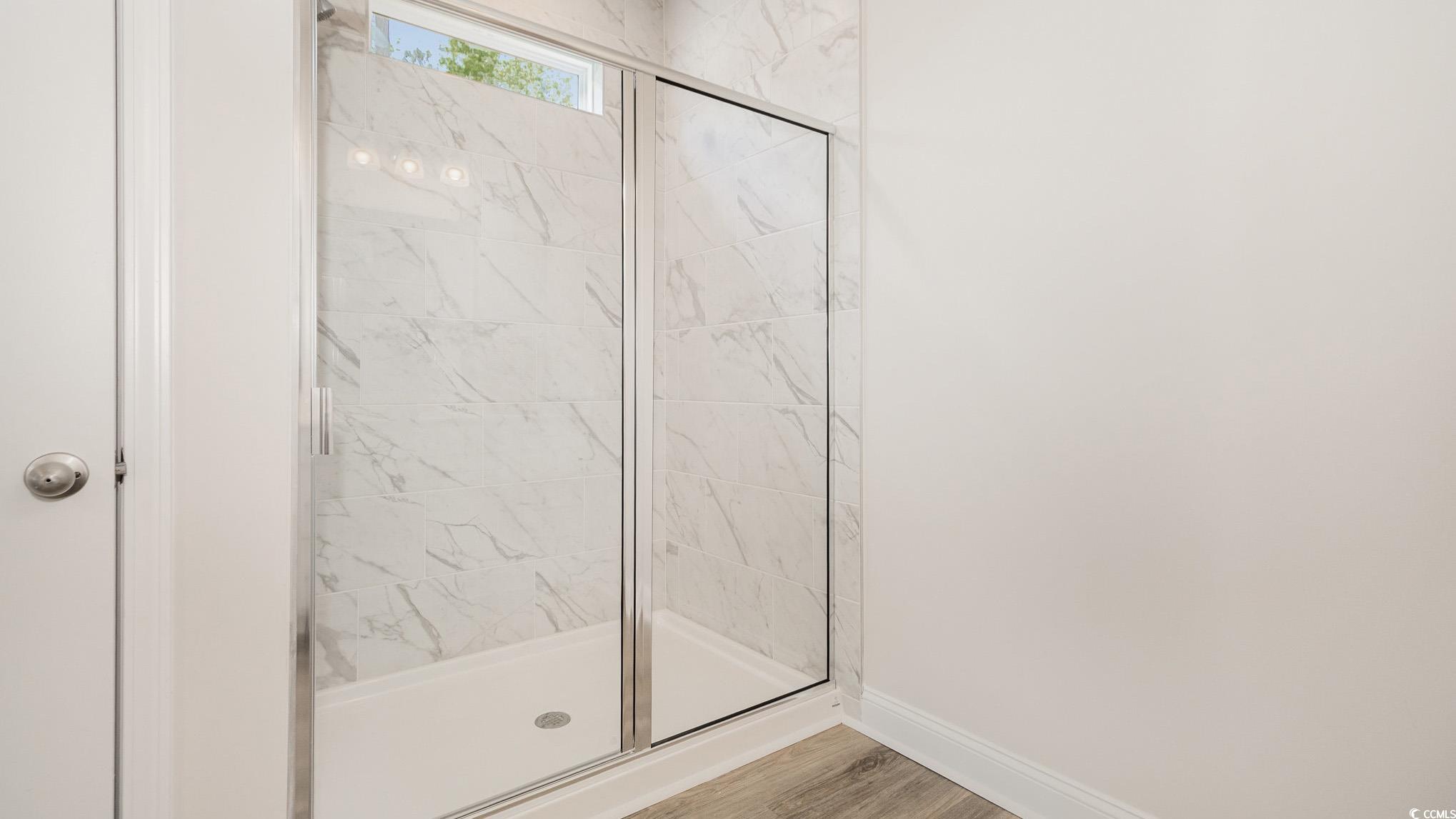 157 Bjorn Way Loris, SC 29569 - Photo 15 of 34 Bathroom with a shower stall and wood finished floors