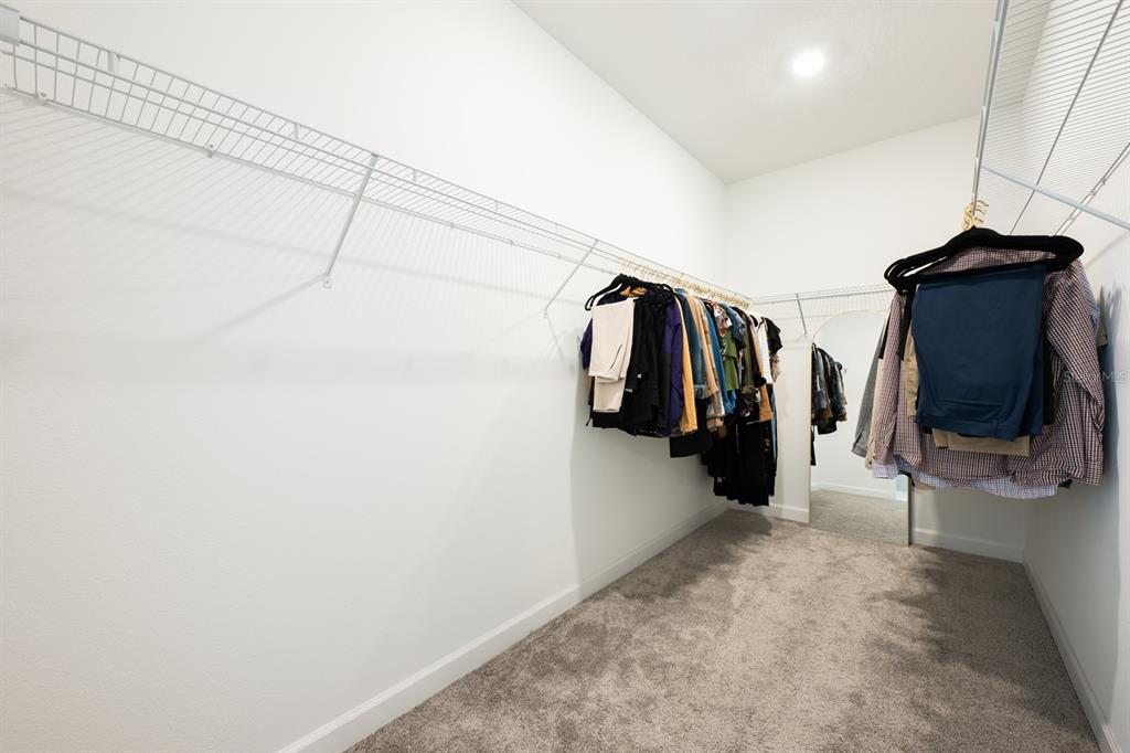 1874 Flourish Avenue Kissimmee, FL 34744 - Photo 13 of 35 a view of walk in closet with clothes