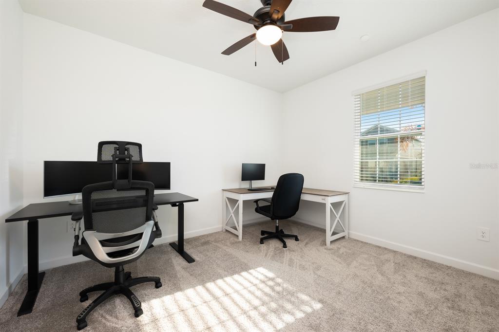 1874 Flourish Avenue Kissimmee, FL 34744 - Photo 16 of 35 a view of a workspace with furniture and a window