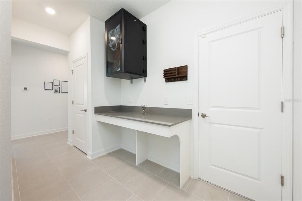 1874 Flourish Avenue Kissimmee, FL 34744 - Photo 19 of 35 a bathroom with a sink and a mirror
