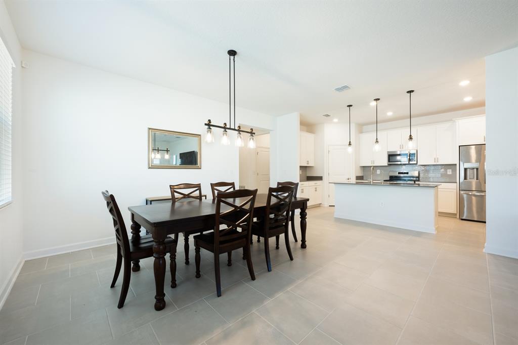 1874 Flourish Avenue Kissimmee, FL 34744 - Photo 2 of 35 a view of a dining room and livingroom