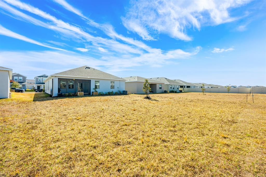 1874 Flourish Avenue Kissimmee, FL 34744 - Photo 22 of 35 a front view of a house with a yard
