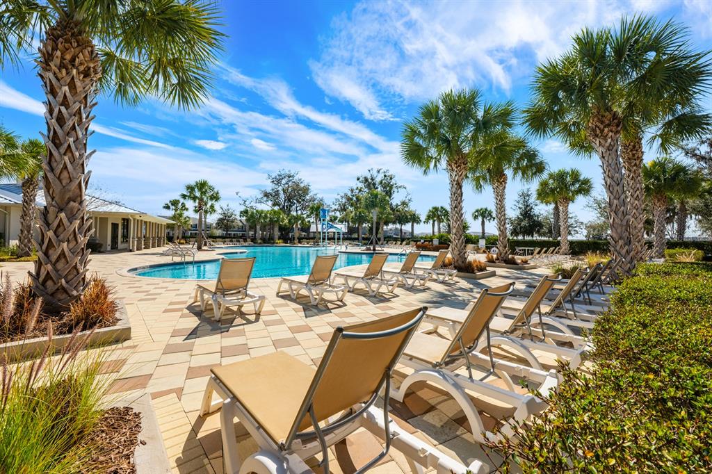 1874 Flourish Avenue Kissimmee, FL 34744 - Photo 26 of 35 a view of a swimming pool with lounge chairs on a patio