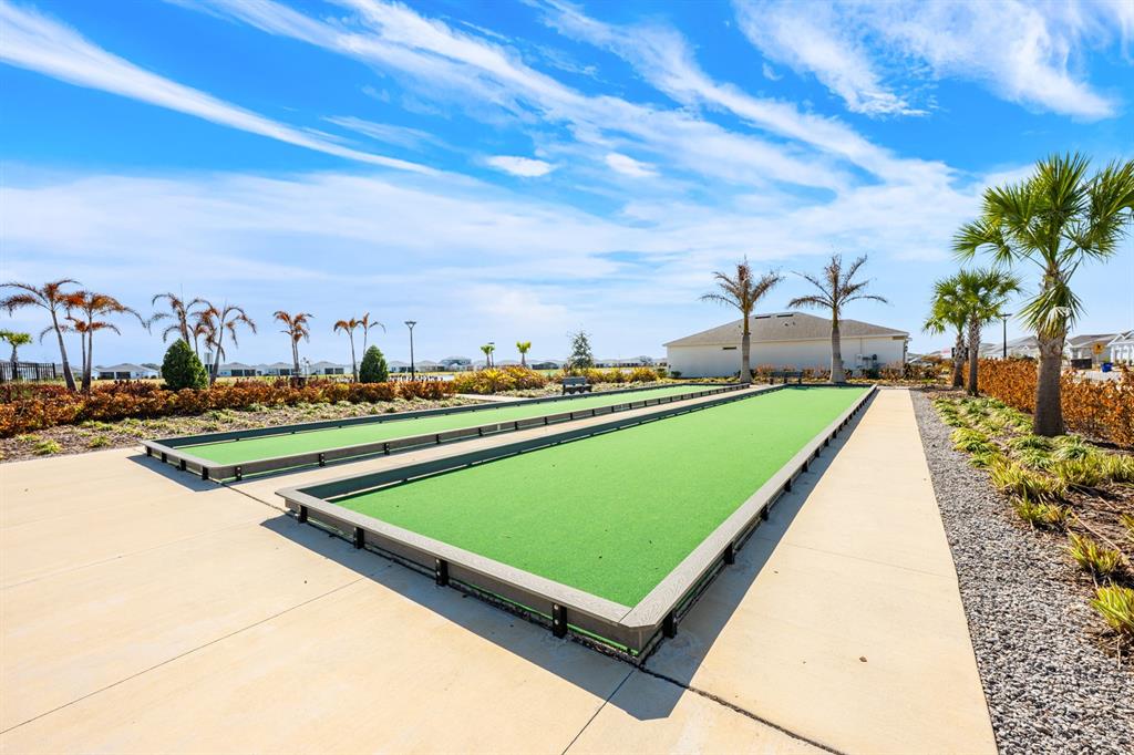 1874 Flourish Avenue Kissimmee, FL 34744 - Photo 32 of 35 a view of swimming pool with seating area and trees around