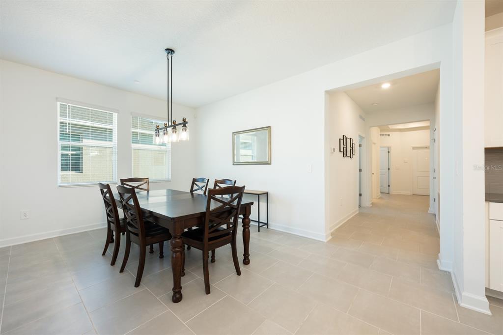 1874 Flourish Avenue Kissimmee, FL 34744 - Photo 8 of 35 a view of a dining room with furniture
