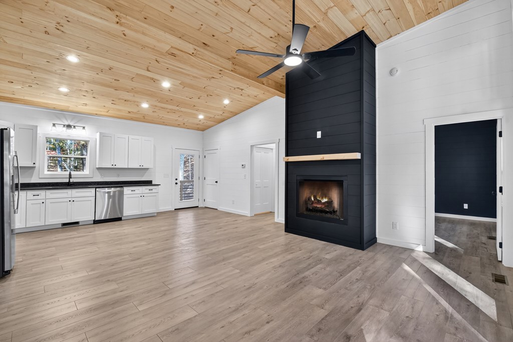 85 Duck Cove Morganton, GA 30560 - Photo 11 of 36 a view of a kitchen with a sink and a fireplace