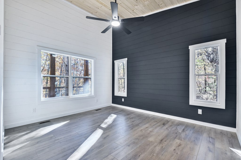 85 Duck Cove Morganton, GA 30560 - Photo 16 of 36 a view of an empty room with a window and wooden floor