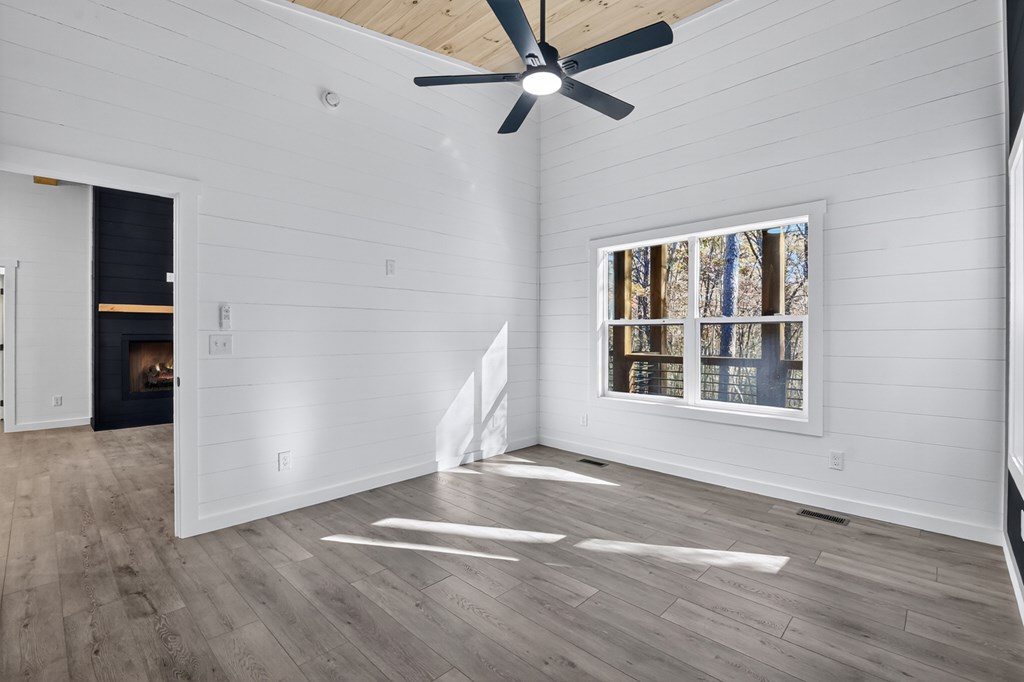 85 Duck Cove Morganton, GA 30560 - Photo 17 of 36 an empty room with wooden floor closet and windows