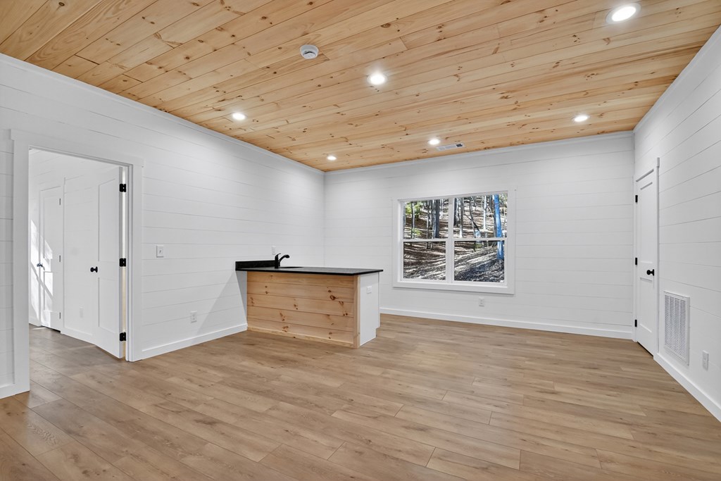 85 Duck Cove Morganton, GA 30560 - Photo 21 of 36 an empty room with wooden floor and white walls