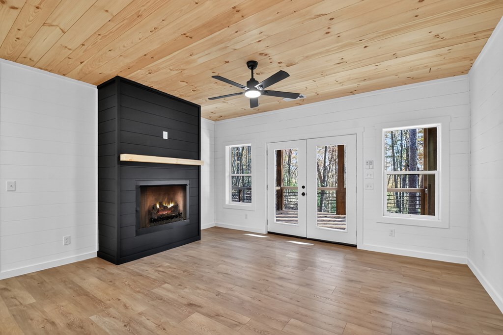85 Duck Cove Morganton, GA 30560 - Photo 25 of 36 an empty room with windows and fireplace