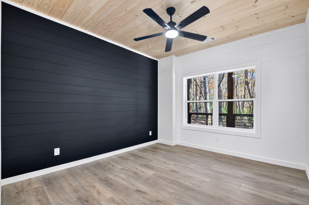 85 Duck Cove Morganton, GA 30560 - Photo 27 of 36 an empty room with a window and a ceiling fan
