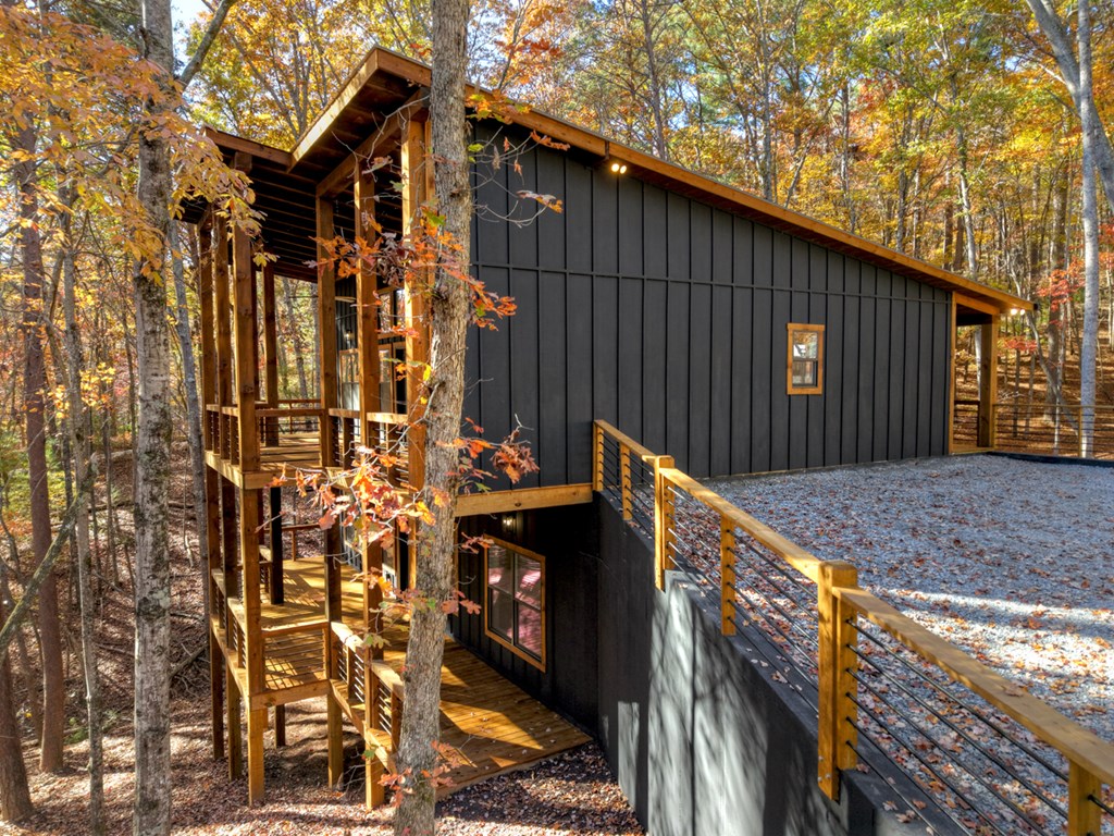 85 Duck Cove Morganton, GA 30560 - Photo 35 of 36 a street view of a house with many windows