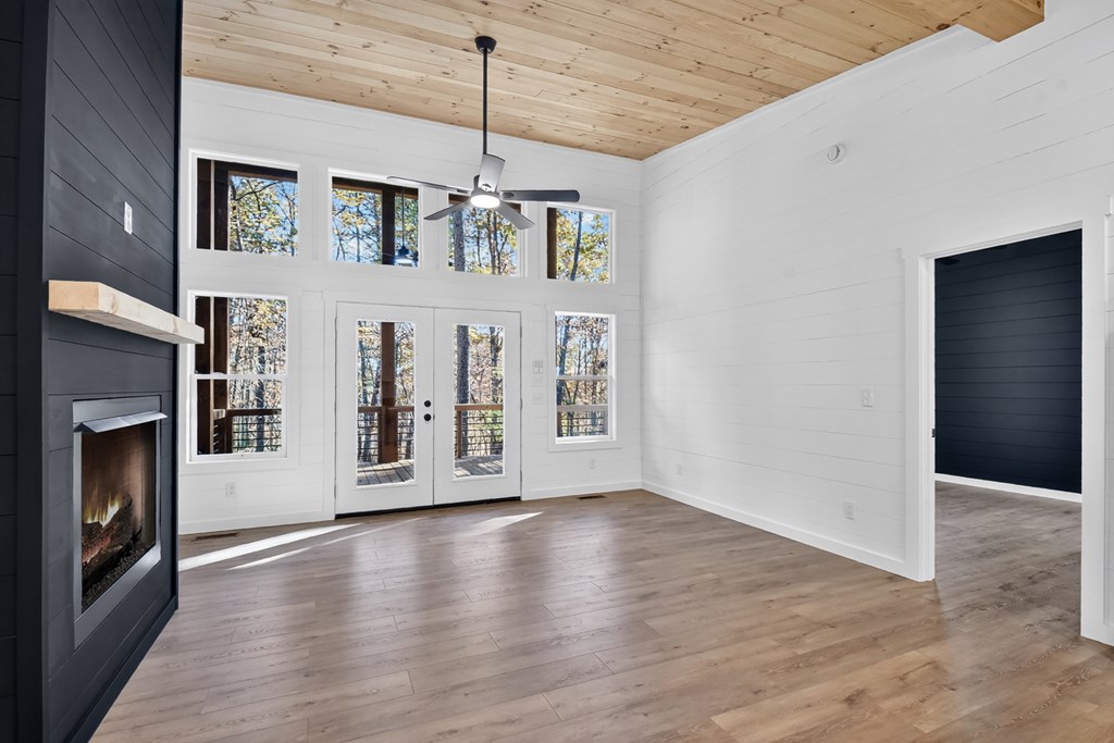 85 Duck Cove Morganton, GA 30560 - Photo 4 of 36 a view of an empty room with a window and fireplace
